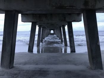 Scenic view of pier over sea against sky