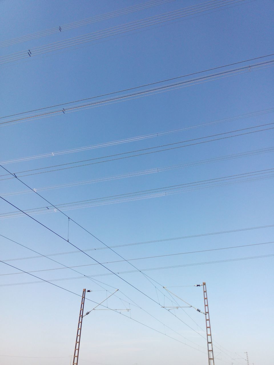 LOW ANGLE VIEW OF POWER LINES AGAINST SKY