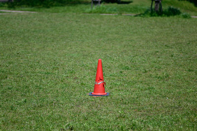 High angle view of red pipe on field