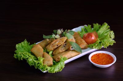 High angle view of vegetables on table against black background