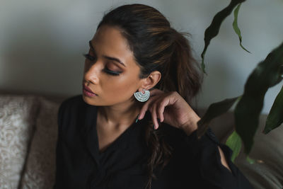 Portrait of young woman looking away