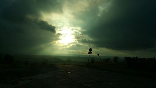 Storm clouds over city during sunset