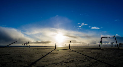 Scenic view of beach against sky during sunset