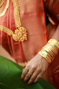 Cropped hand of woman with henna tattoo