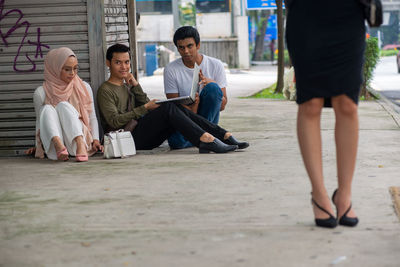 Group of people sitting outdoors