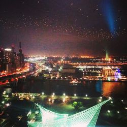 Illuminated cityscape at night