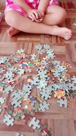 Low section of child playing on table