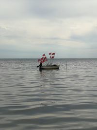 Boat on sea against sky