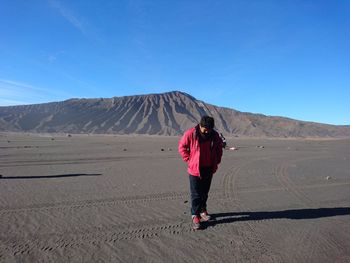 Full length of man standing at desert