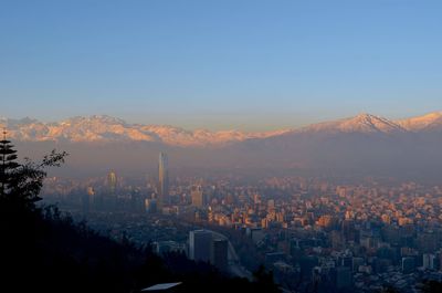 High angle view of buildings in city against clear sky