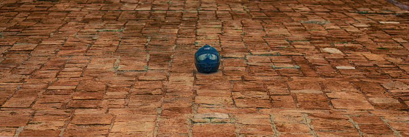 High angle view of stone wall on footpath