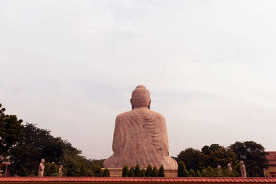 Low angle view of statue against sky