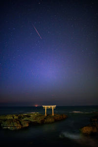 Scenic view of sea against sky at night