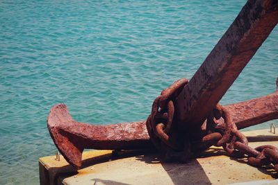 Close-up of rusty pier over sea