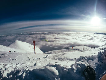 Scenic view of snow covered mountain against sky