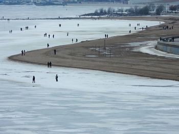 High angle view of people on frozen baltic sea