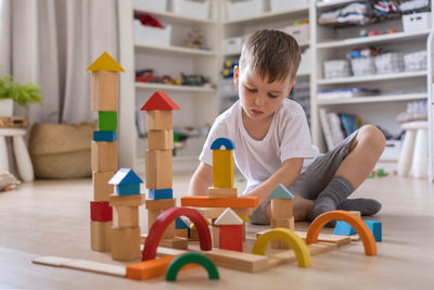 Boy playing with toy blocks