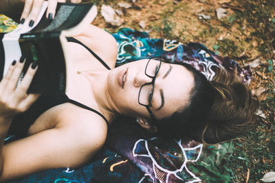 Portrait of young woman using mobile phone