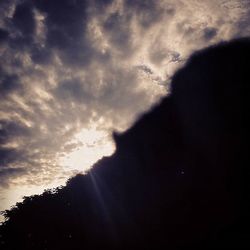 Low angle view of cloudy sky at sunset