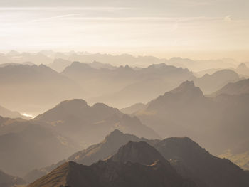 Scenic view of mountains against sky during sunset