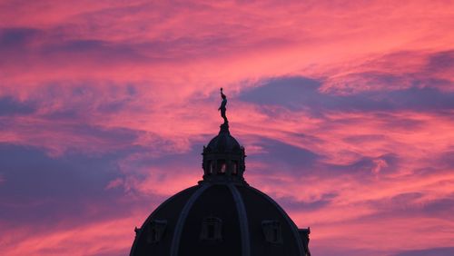 Low angle view of church against sky during sunset