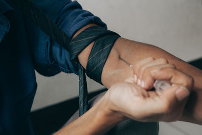 Close-up of man holding hands