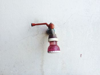 Close-up of shower head against the wall