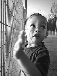 Portrait of cute boy standing outdoors