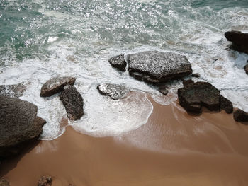 High angle view of rocks in sea