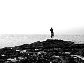 Silhouette of man standing on beach