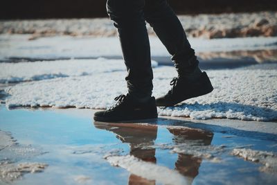 Low section of person standing on ground