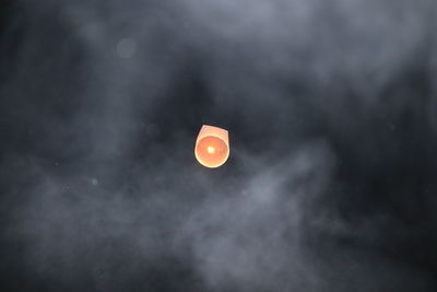 Low angle view of moon against sky at night