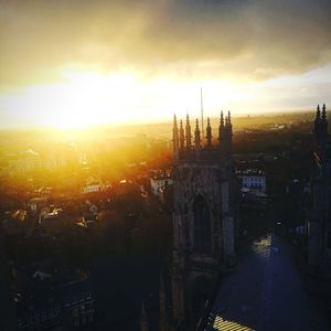 Cityscape against sky during sunset