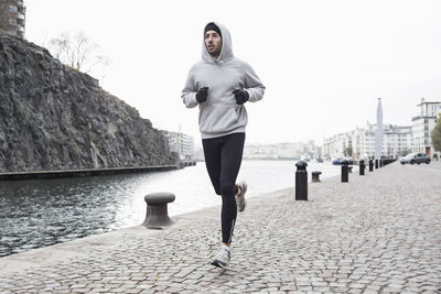 Man jogging at canal side