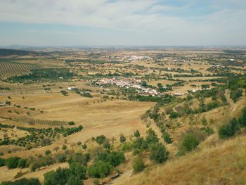 Aerial view of agricultural landscape against sky