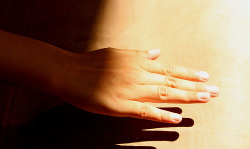 Close-up of person hand feeling sunlight