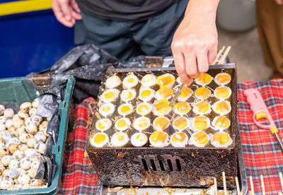 Midsection of man preparing food