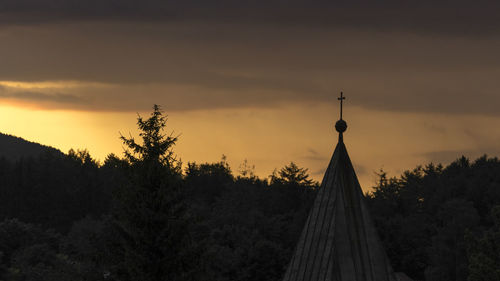 Silhouette of temple against sky during sunset