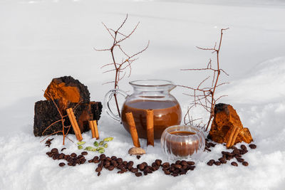 Close-up of coffee beans in glass jar on table