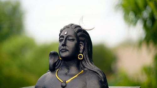 Lord ganesha, adiyogi and maa durga idol or statue isolated at green leaves background. indian