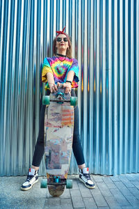 Portrait of woman wearing sunglasses standing outdoors