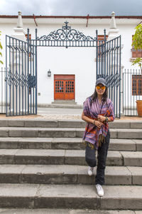 Woman walking down steps in the white city of popayan, colombia