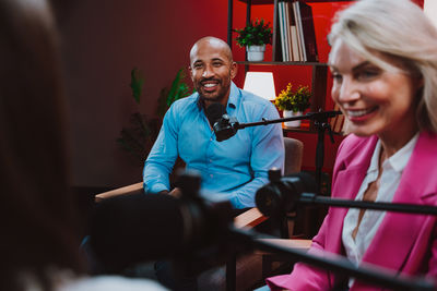 Portrait of smiling young woman looking away