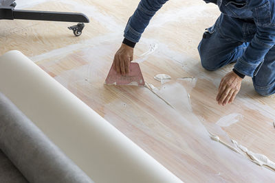 Low section of man standing in workshop