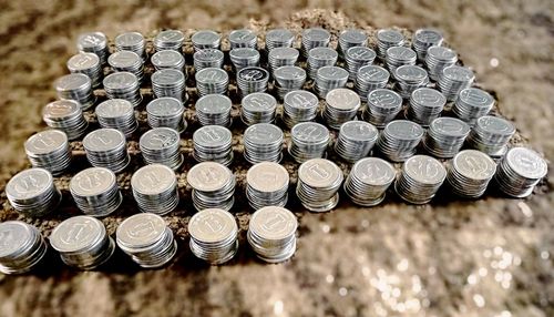 High angle view of coins on table