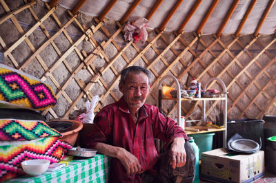 Portrait of man working at market