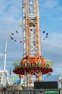 Low angle view of ferris wheel against sky