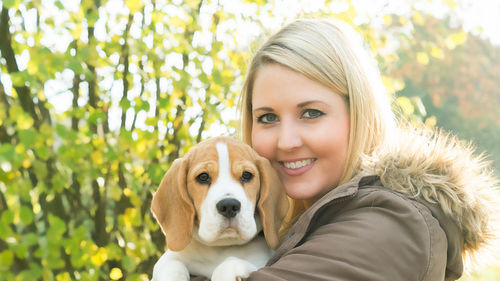 Portrait of young woman with dog