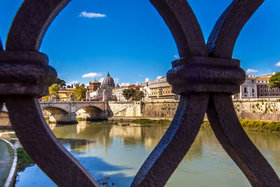 Arch bridge over river in city