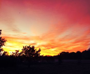 Scenic view of landscape against sky at sunset